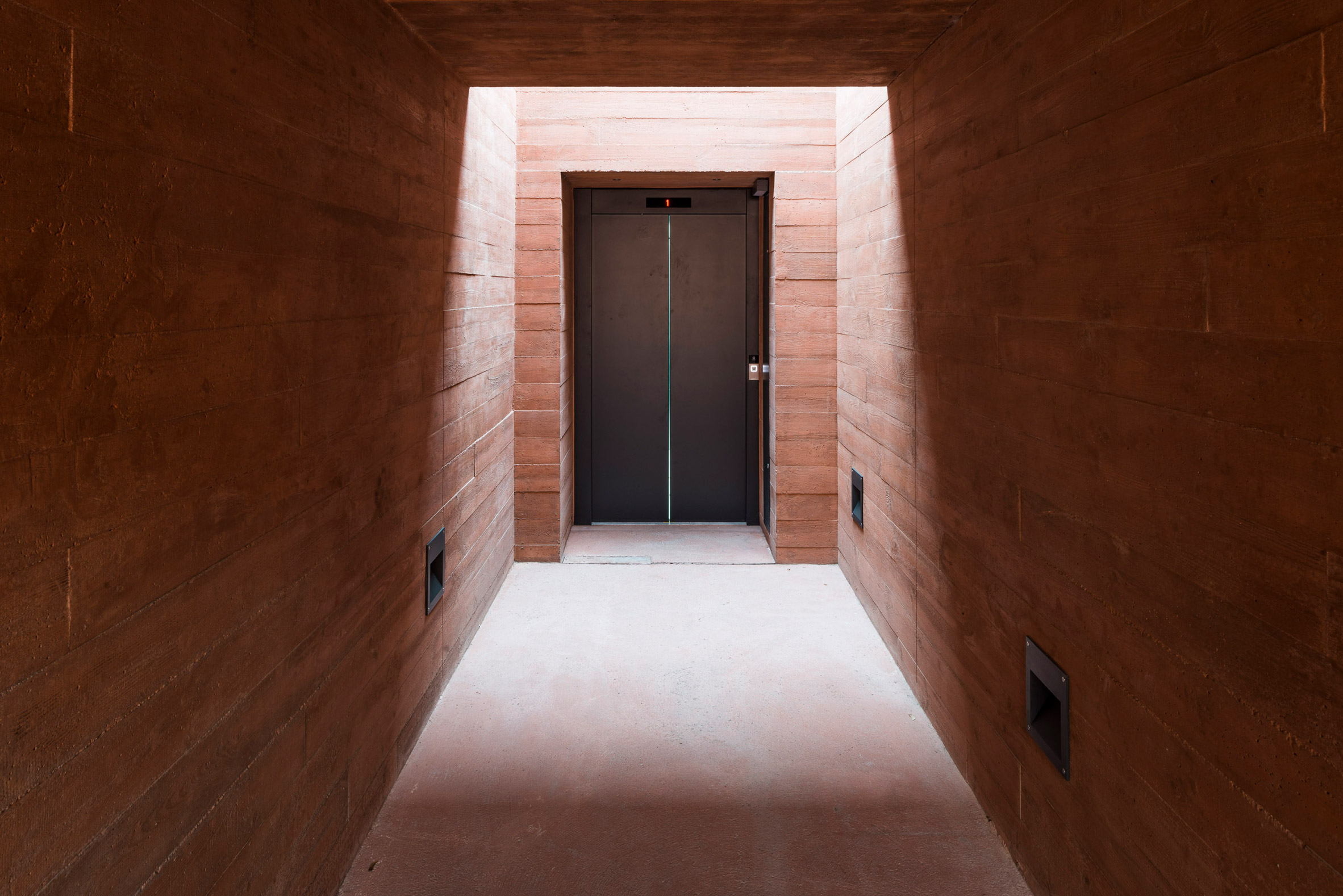 BBGK Architekci uses stained concrete walls to create Katyn Museum inside Warsaw barbican-12