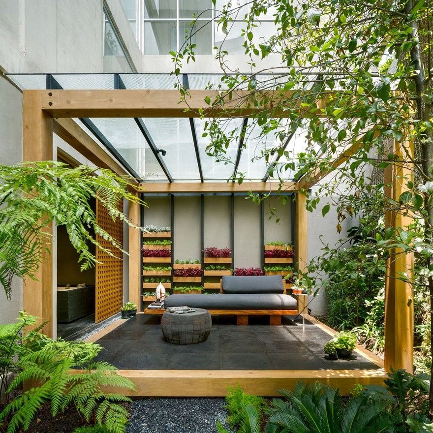 Jardin Apartment Provides a Close Connection of Living Spaces with Patios and Interior Gardens-25