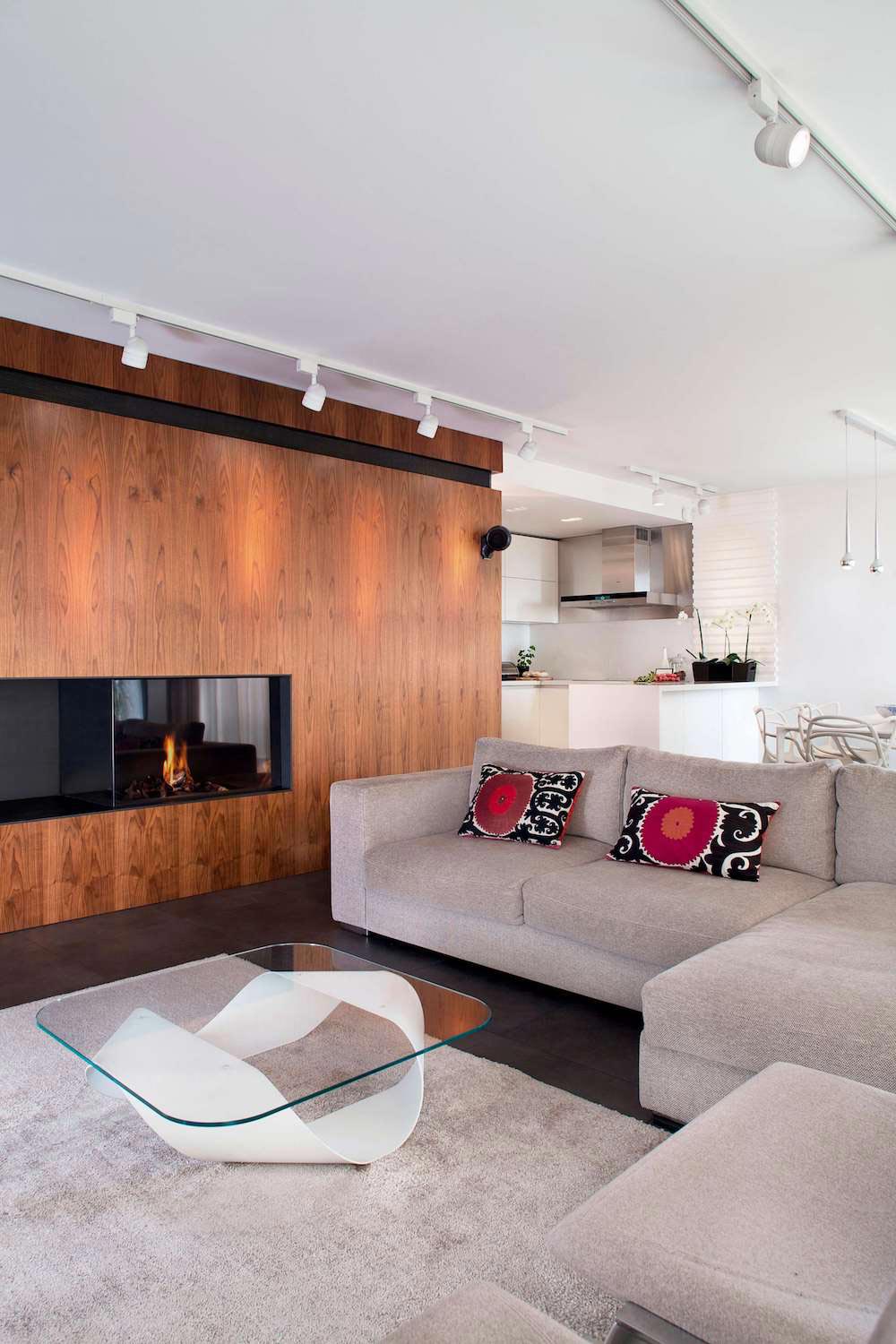 E2 Apartment designed in white and grey with a touch of a wood paneling around fireplace by Tchenguelieva Staynov Architects   CAANdesign  Architecture and home design blog-2