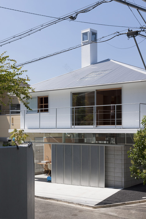 House in Kawanishi by Tato Architects with hipped roof and stilts-2