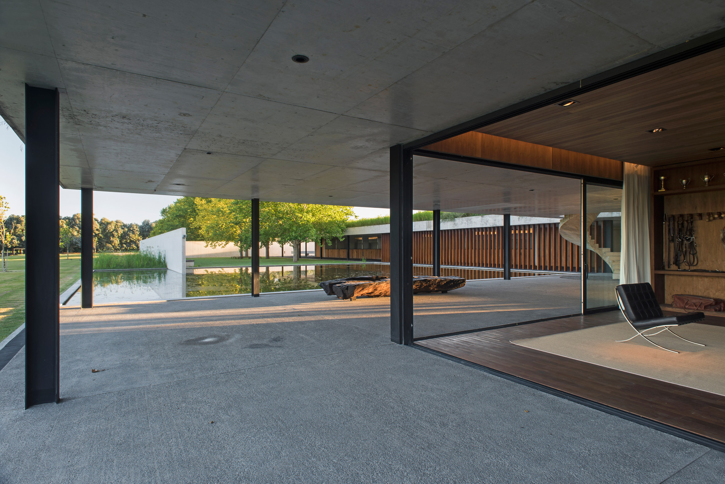 Polo stables features grassy roof for horses to graze and spectators to sit-6