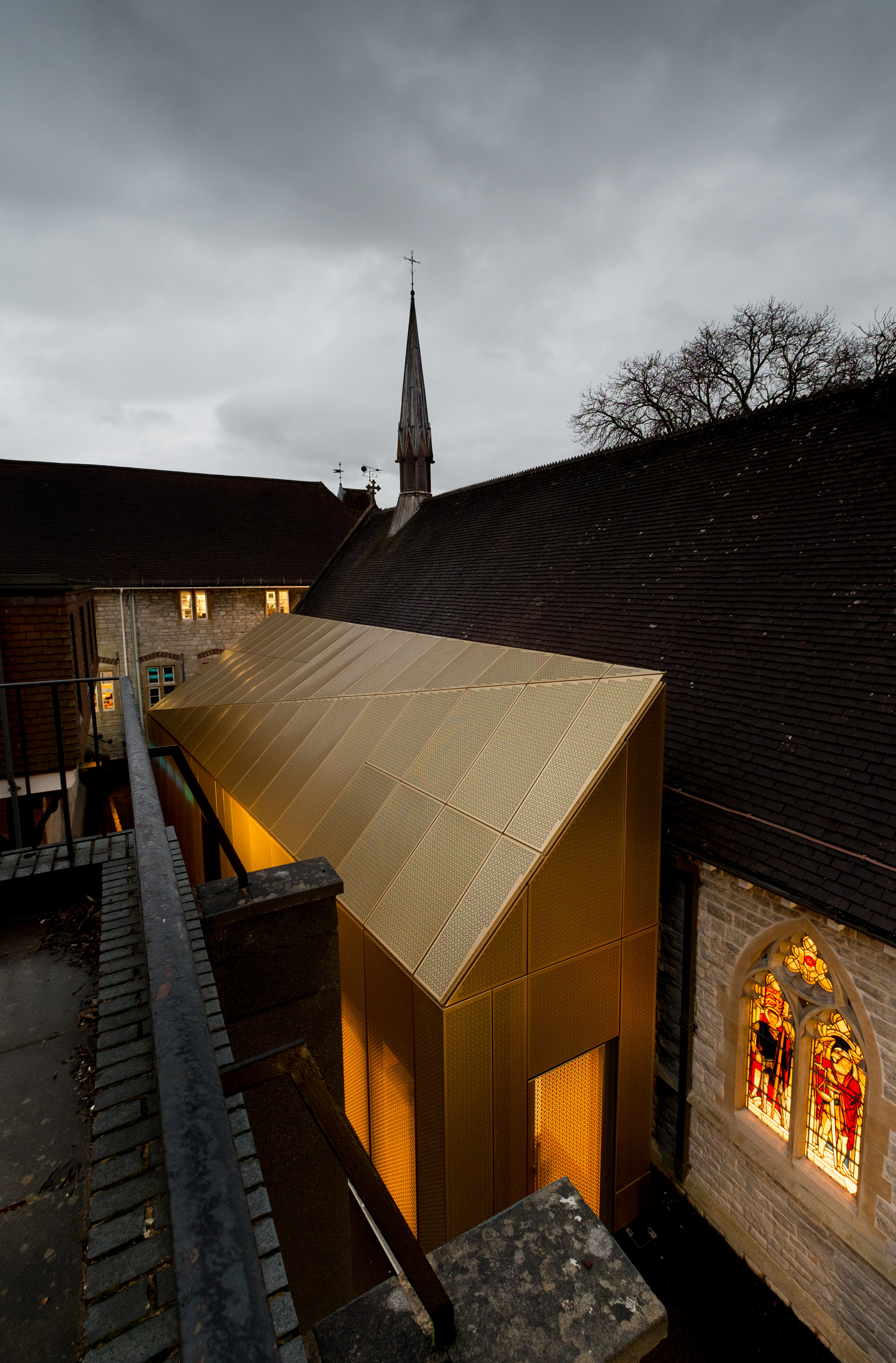 Gold extension added to Winchester university chapel by Design Engine-6