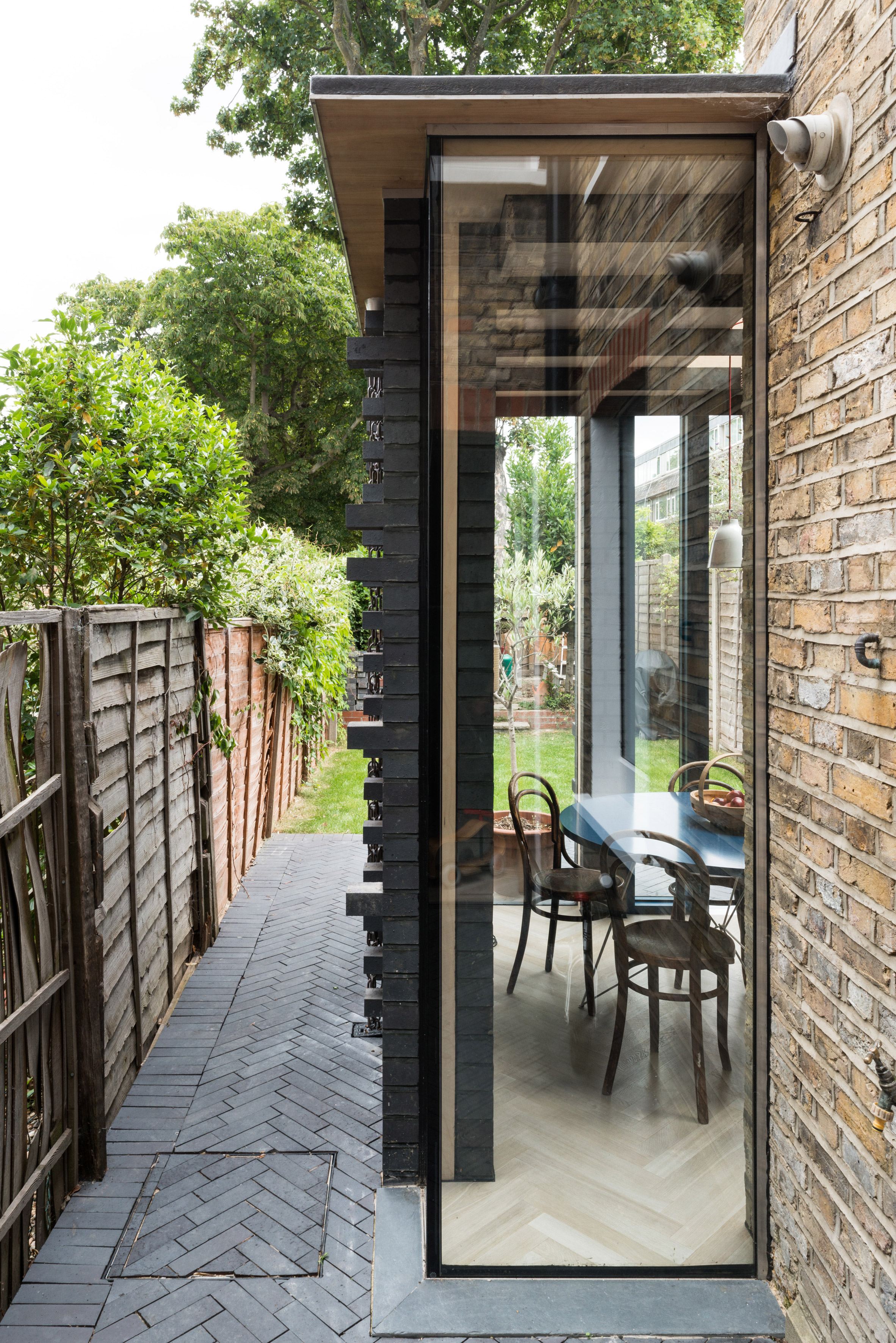 MW Architects creates 7sq m house extension in dark engineering bricks-5