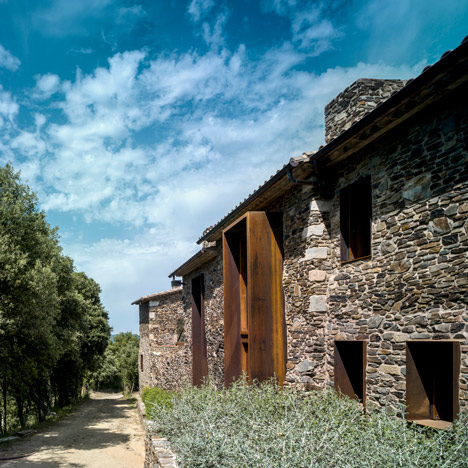 Weathered steel and stone combine in Zest Architecture's restored farmhouse-0