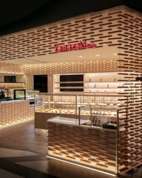 山崎面包美罗城店 | 红洞石营造独特包裹感