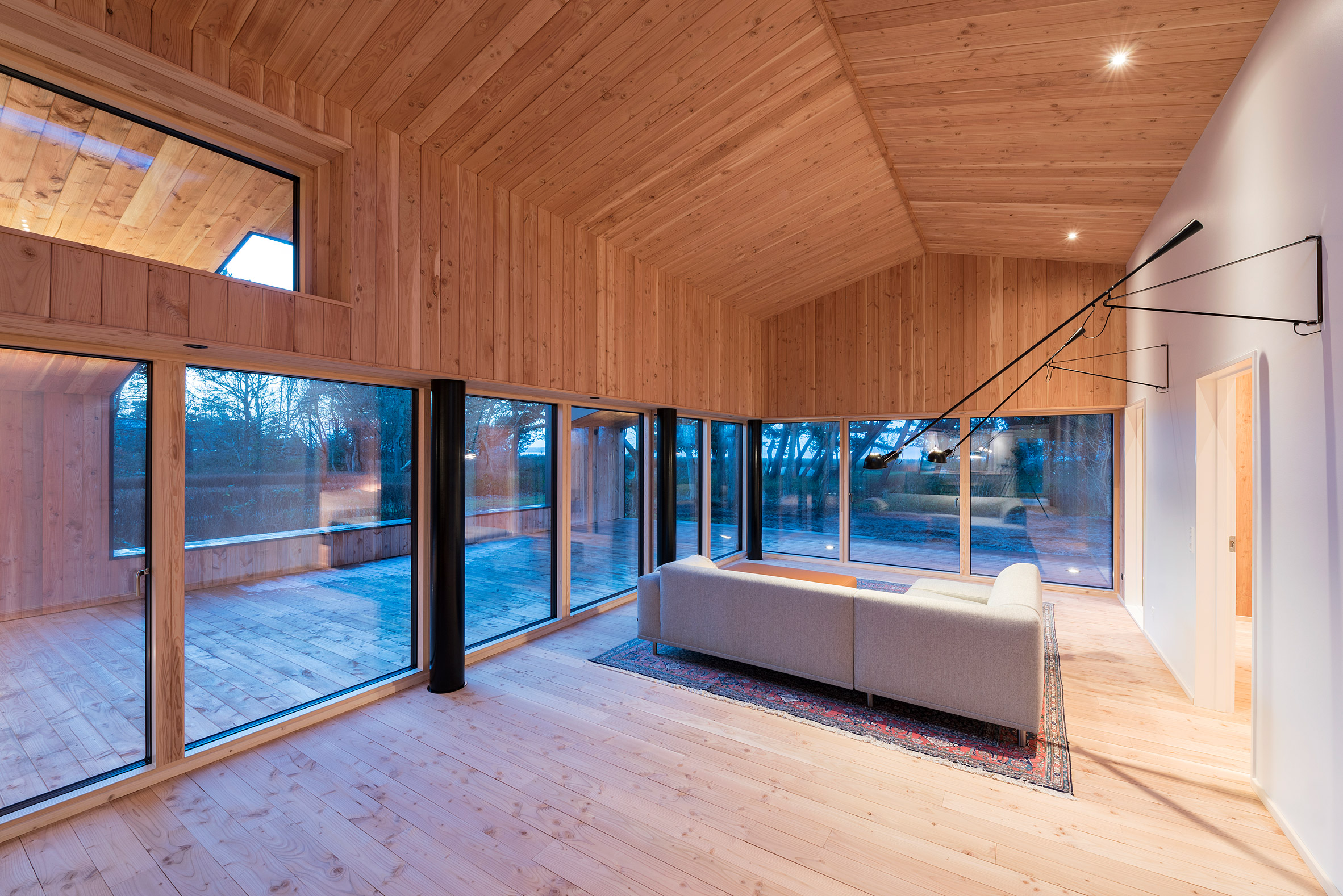 Oversized roof shelters terraces at CEBRA's Danish summer house-17