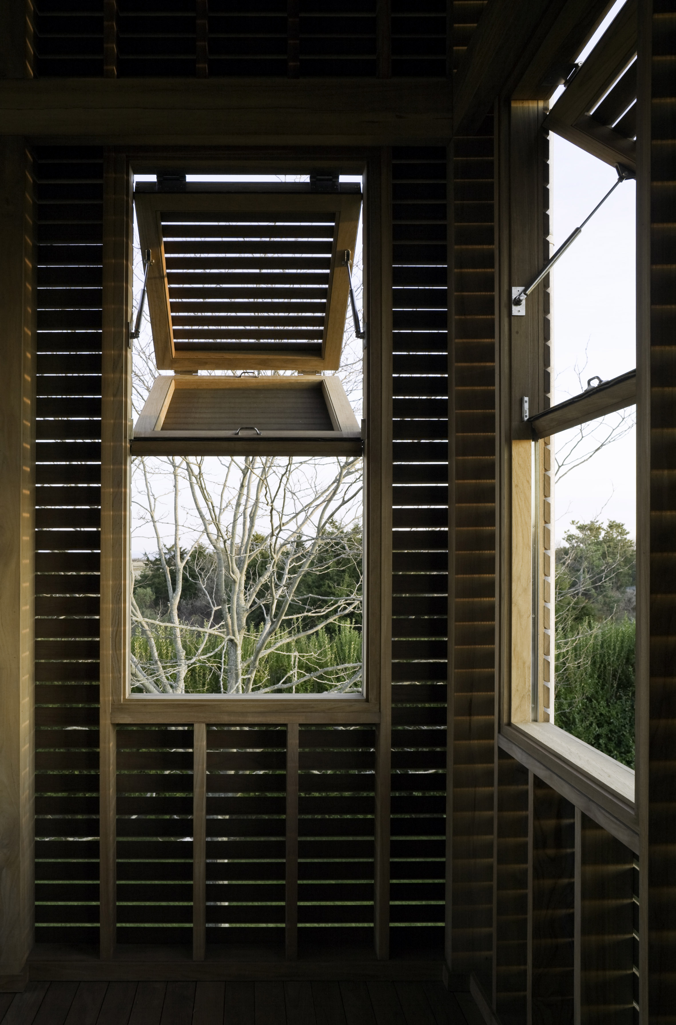Lights glow through facades of Hamptons home by Leroy Street Studio-6
