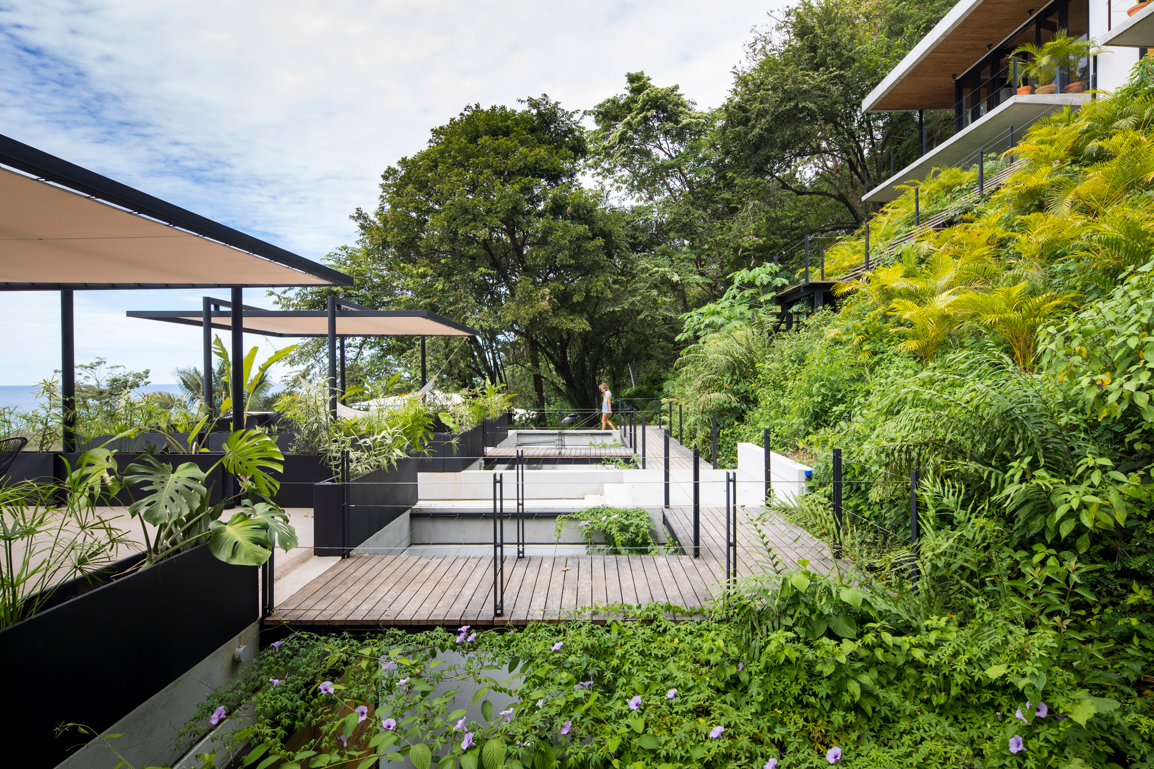 Staggered pavilions form holiday resort on lush hill in Costa Rican surf town-4