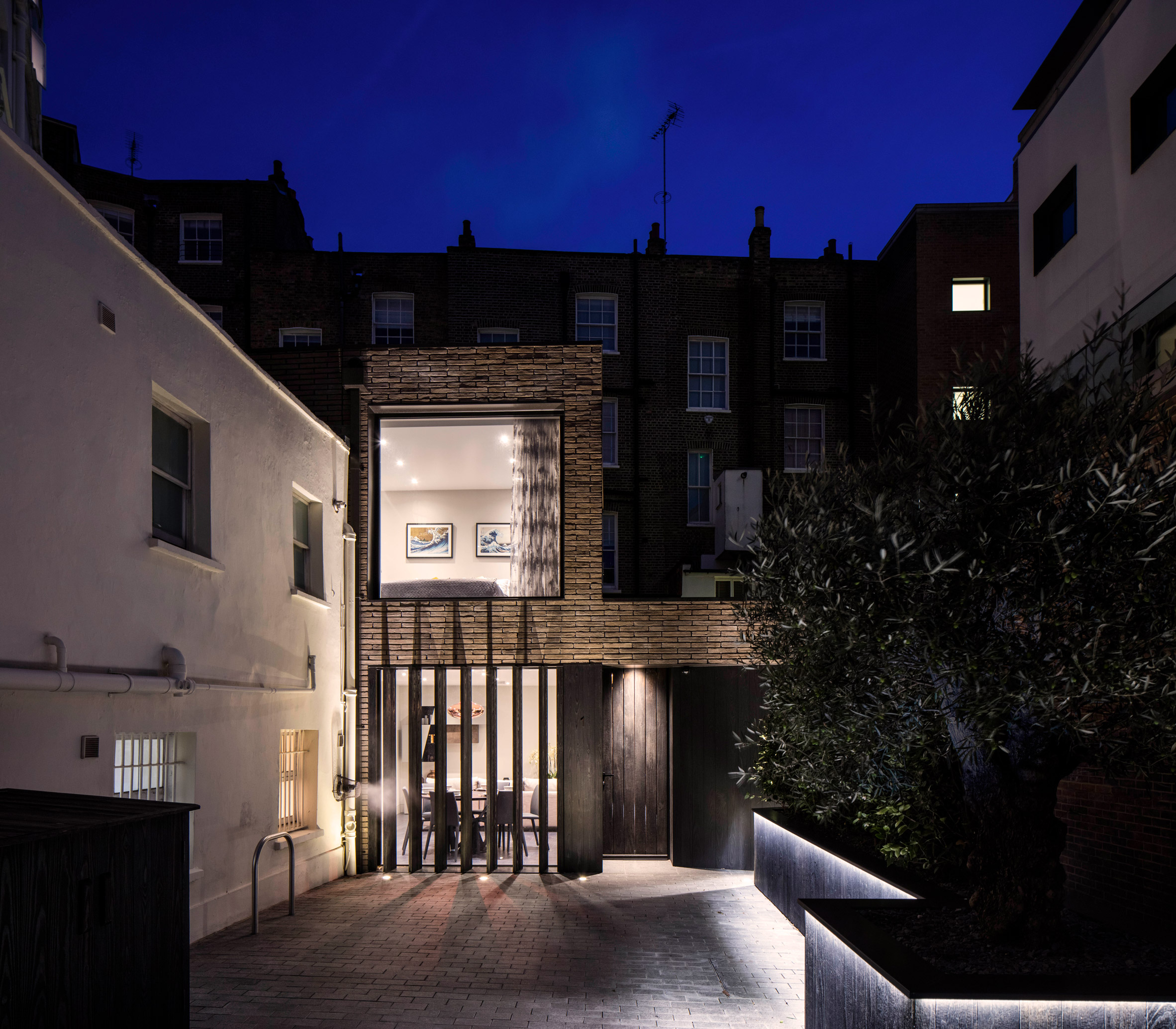 Pivoting louvres conceal windows of mews house by Belsize Architects-15