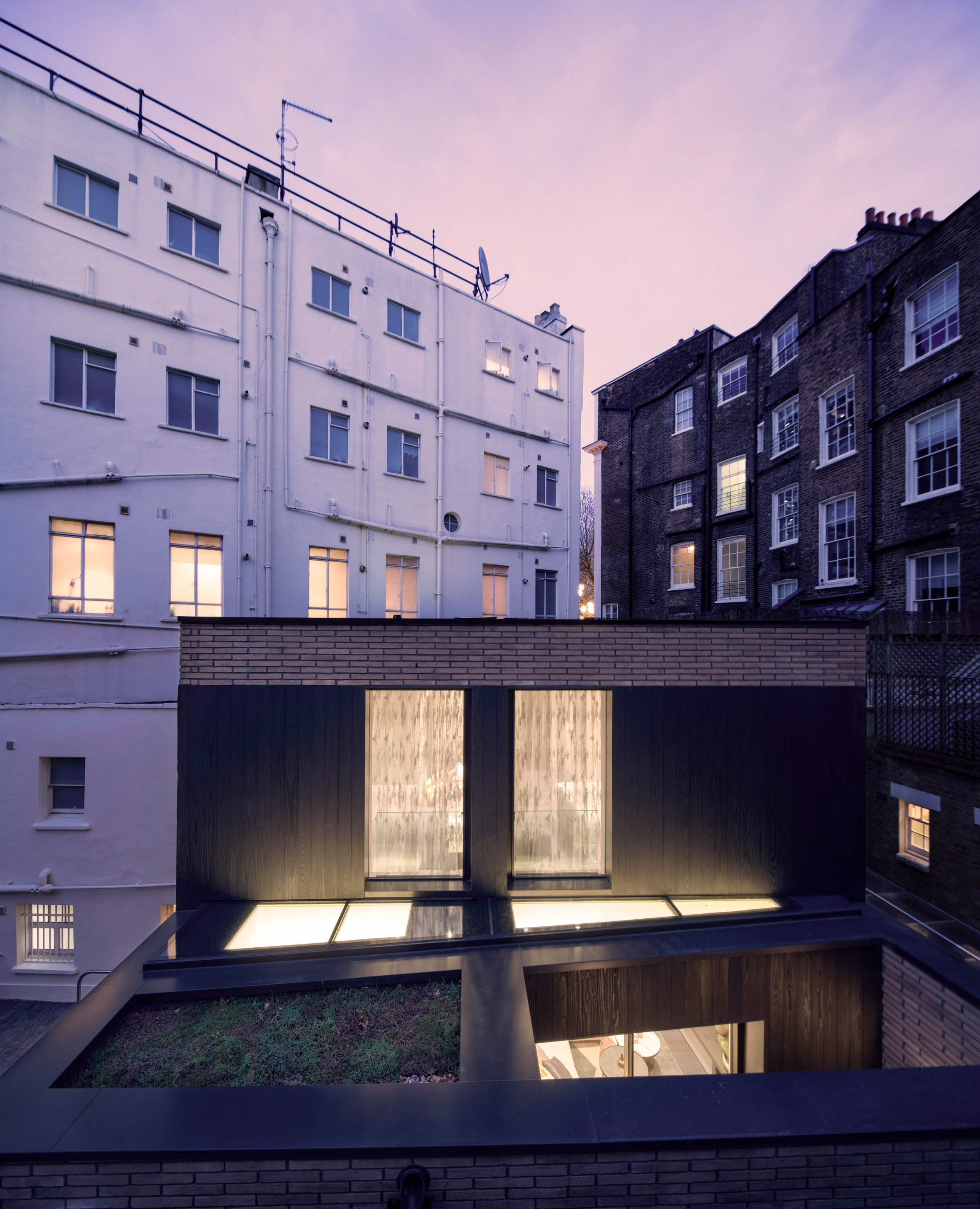 Pivoting louvres conceal windows of mews house by Belsize Architects-11