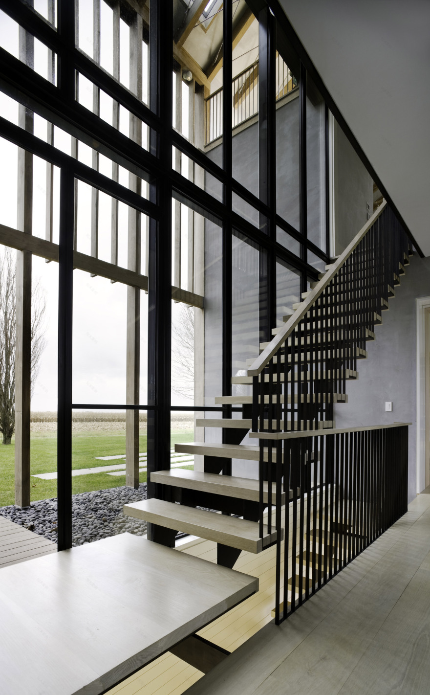 Lights glow through facades of Hamptons home by Leroy Street Studio-8