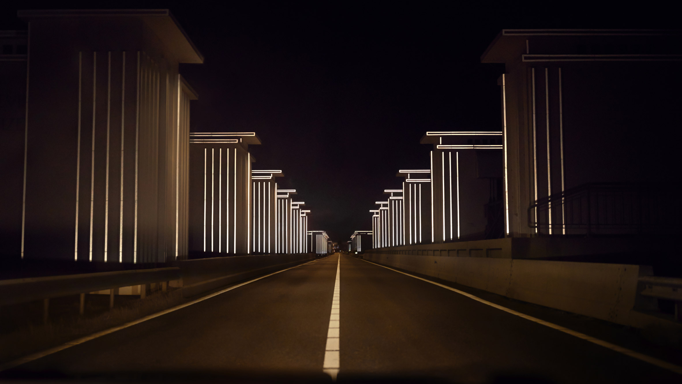 Restored floodgates by Studio Roosegaarde reflect the headlights of cars-0