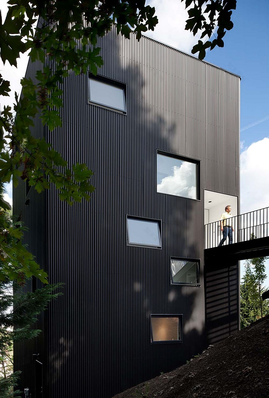 Modern Vertical House Accessed by a Steel Pedestrian Bridge-22