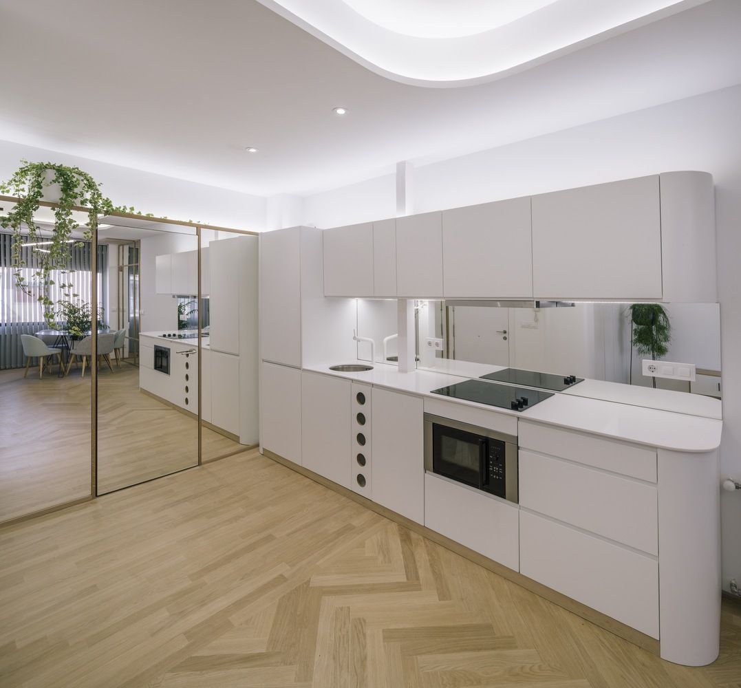 Glass Walls and Lots of Curves Distinguish Luxury Madrid Apartment Renovation-3