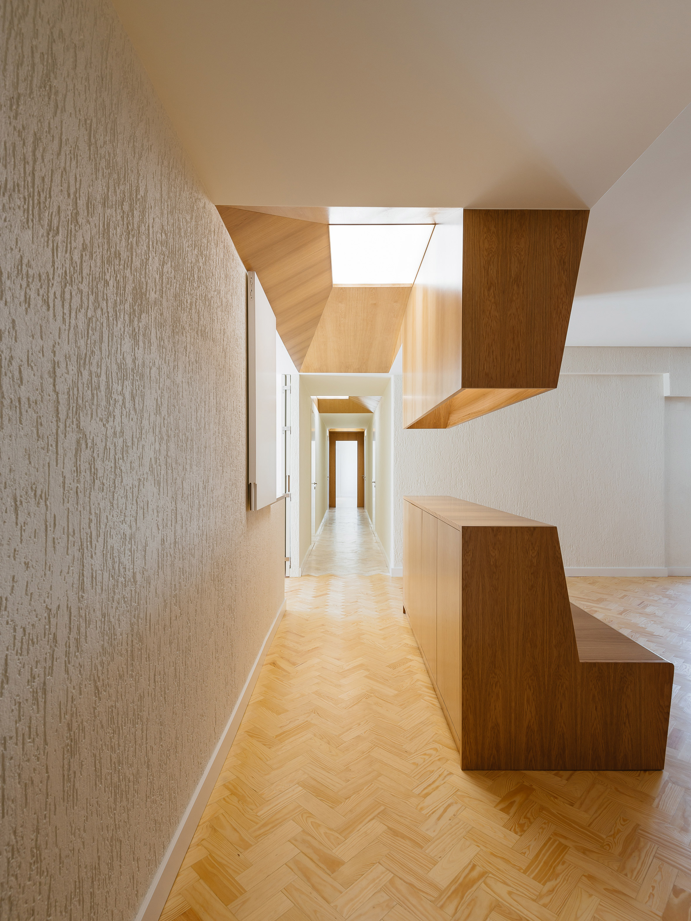 Skylights and folding walls update 1970s Lisbon apartment-8