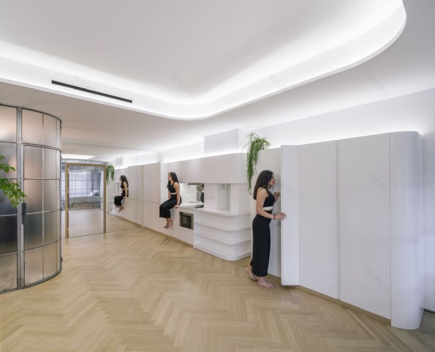 Glass Walls and Lots of Curves Distinguish Luxury Madrid Apartment Renovation-5