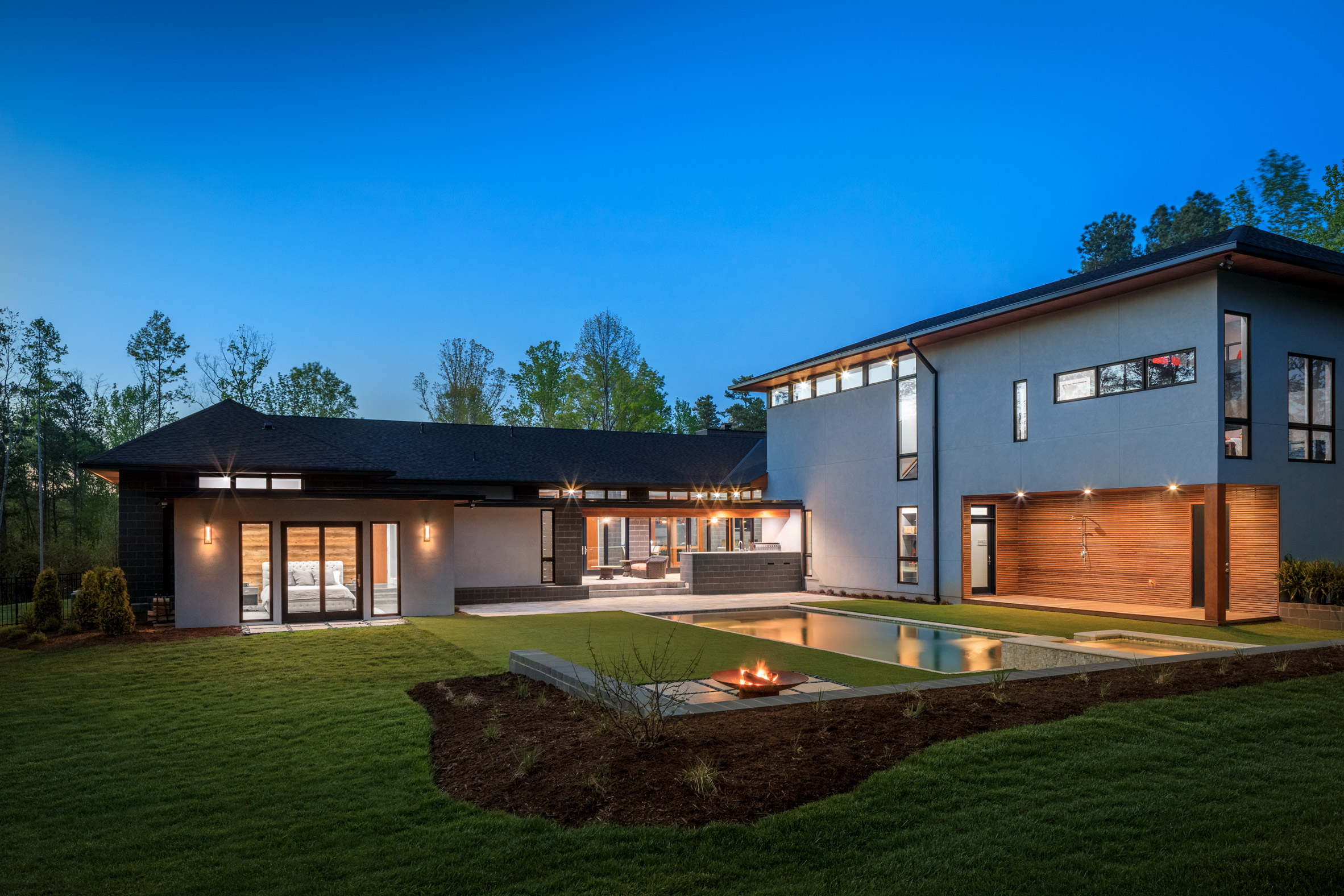 Grey stone, stucco and warm timber wrap South Carolina home by Marica McKeel-22