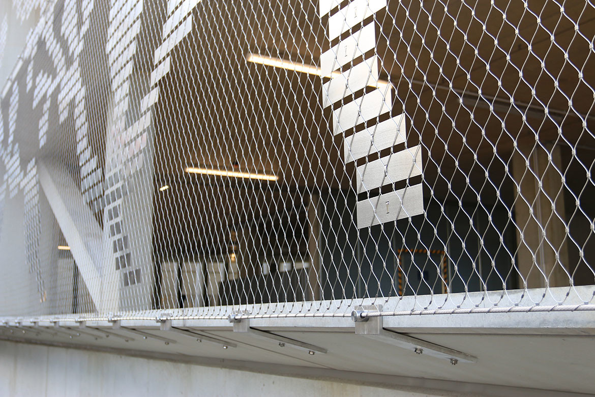 Held together by function and aesthetics: tensile mesh barriers and facades | IndesignLive-1