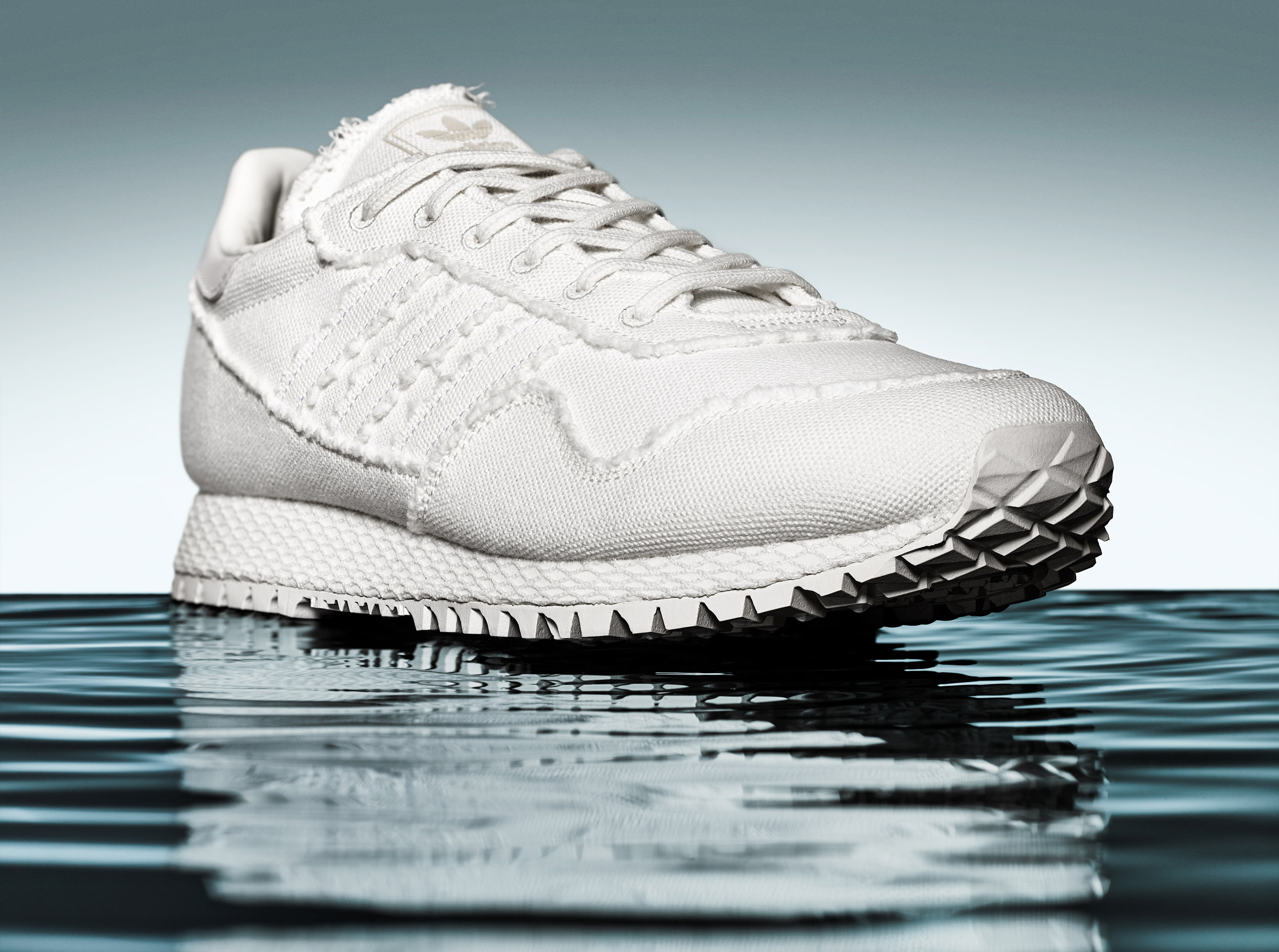 Daniel Arsham bases all-white Adidas trainers on archaeological artefacts-3