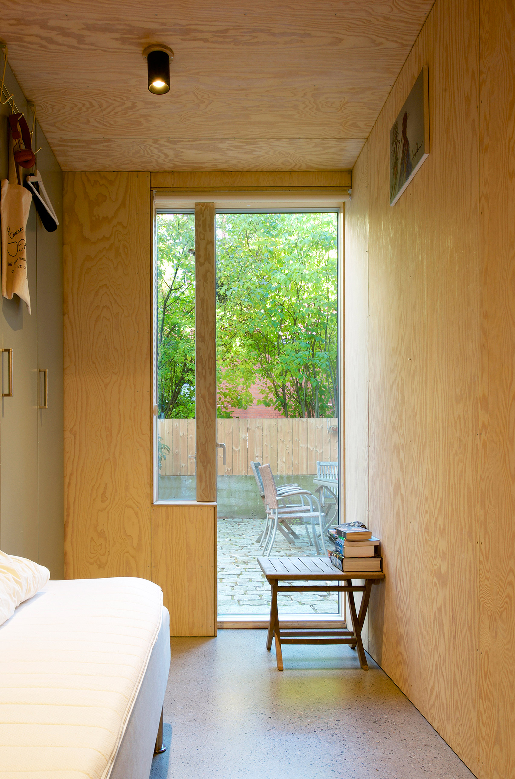 Weathering steel panels create rusty walls for house in Oslo's old town-15