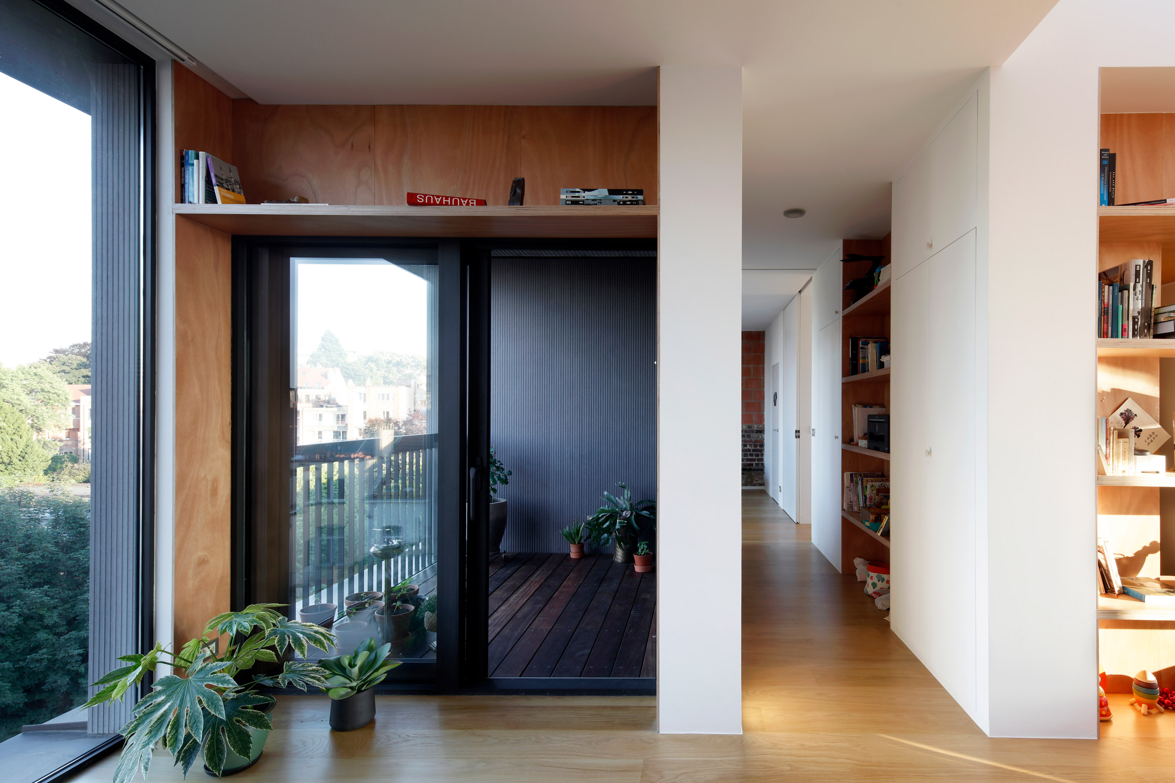 Alvar Aalto inspired the orange fireplace in this Brussels roof extension-16