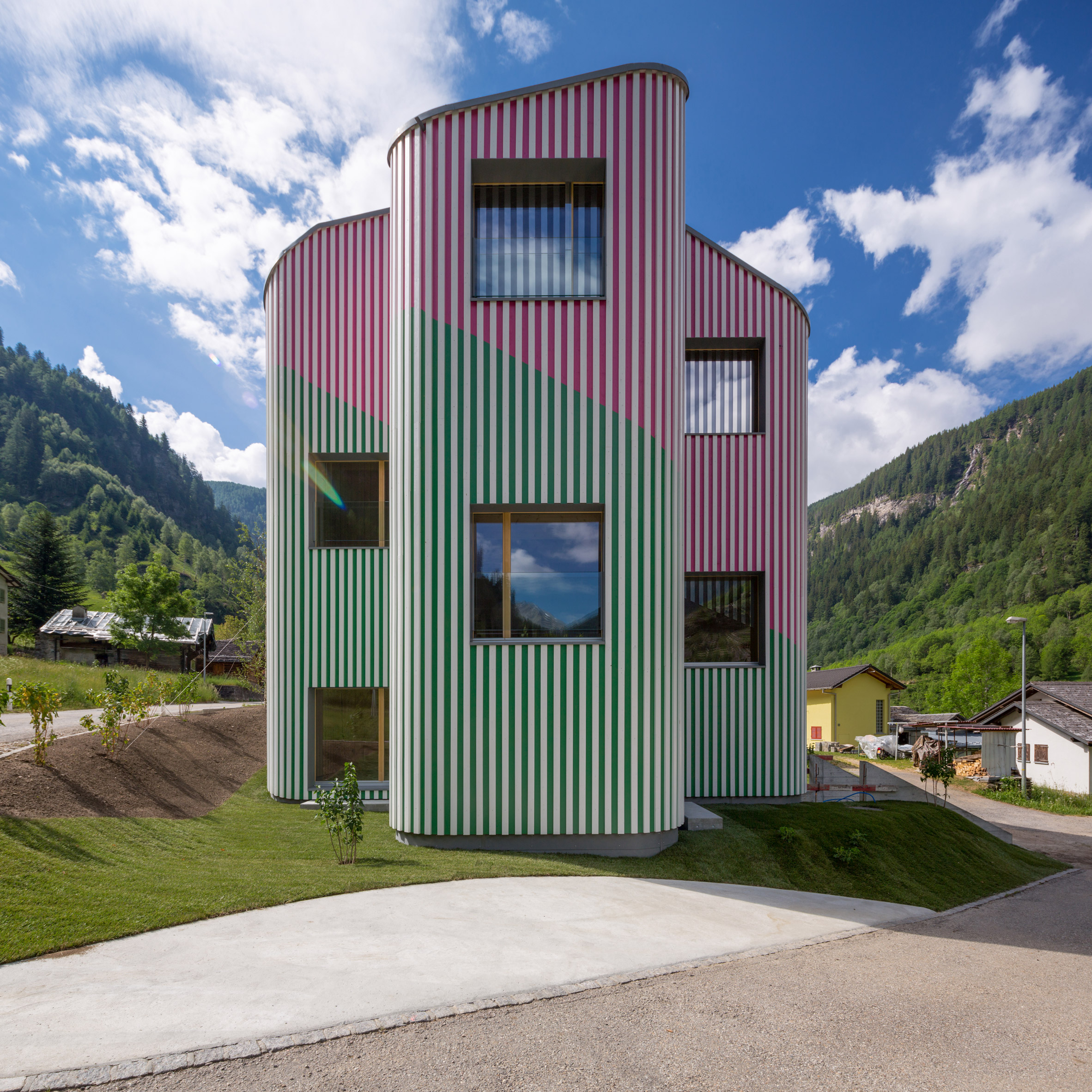 Swathes of green and pink paint cover undulating walls-0