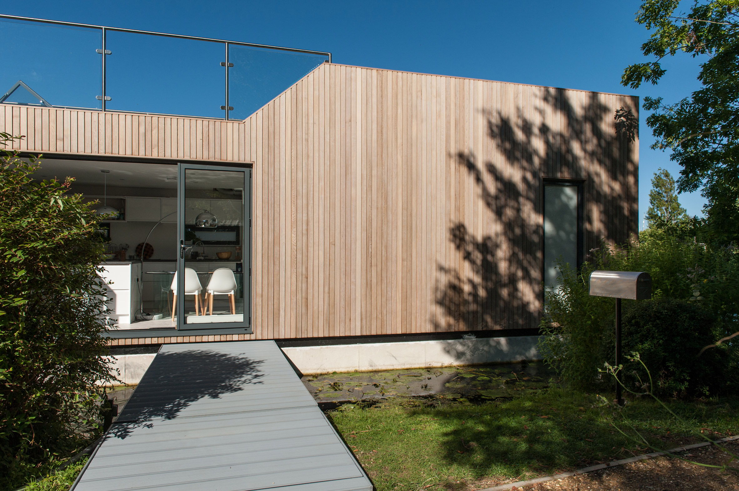Baca Architects moors wooden floating home on Chichester Canal-5