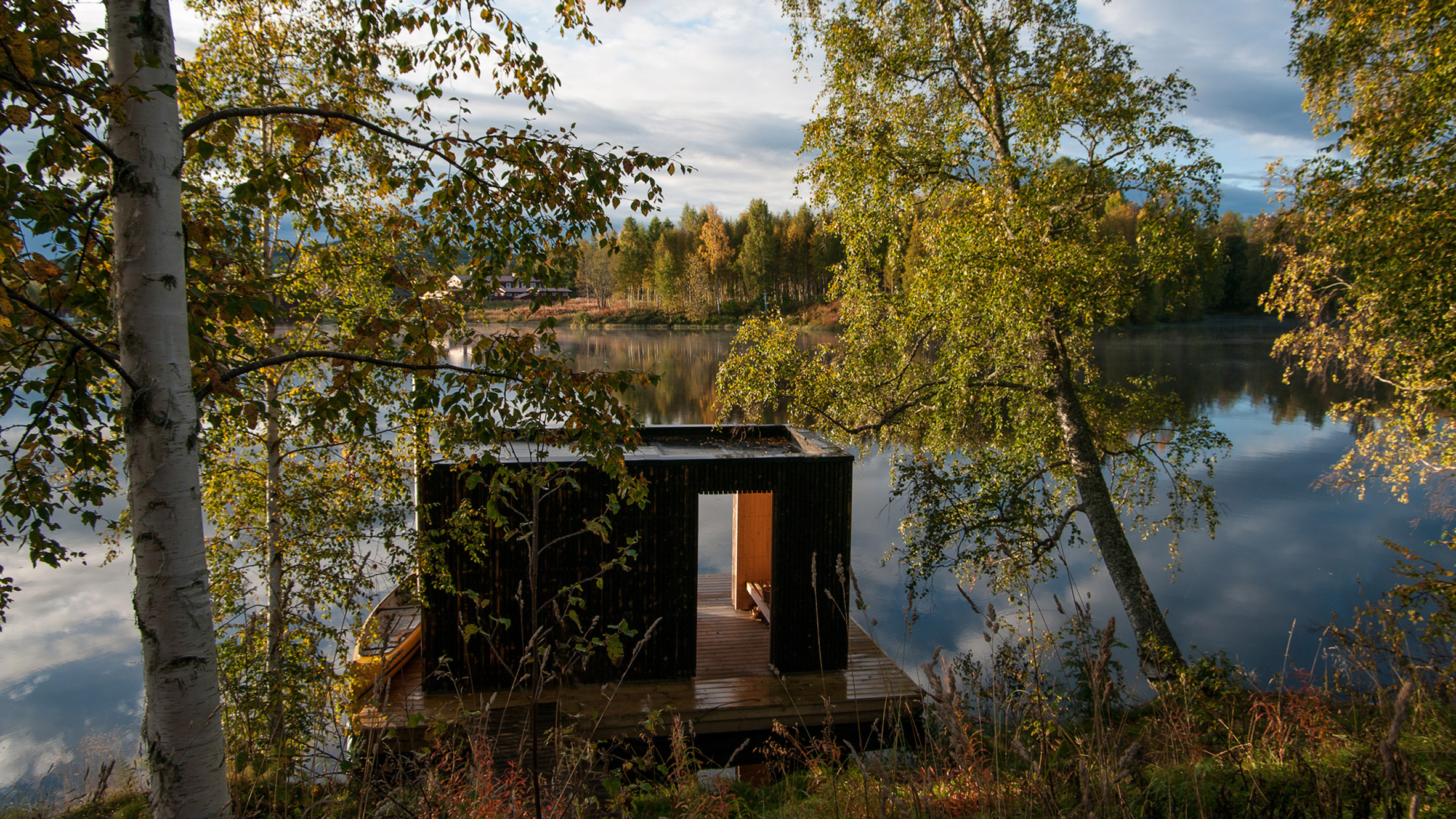 Small Architecture Workshop's charred-wood sauna floats on Swedish lake-2