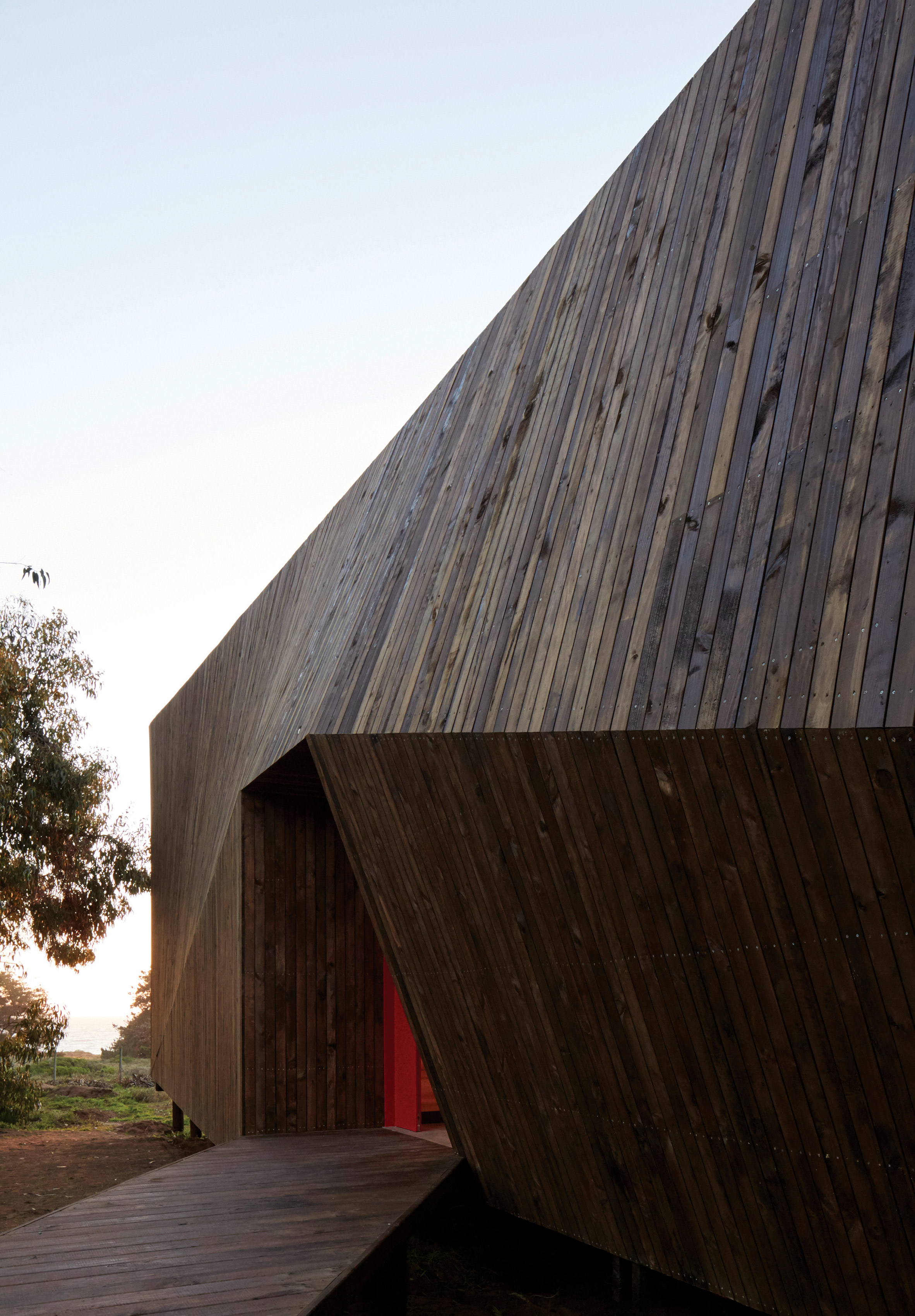 Faceted house in Chile by Verónica Arcos offers ocean views through the forest-6