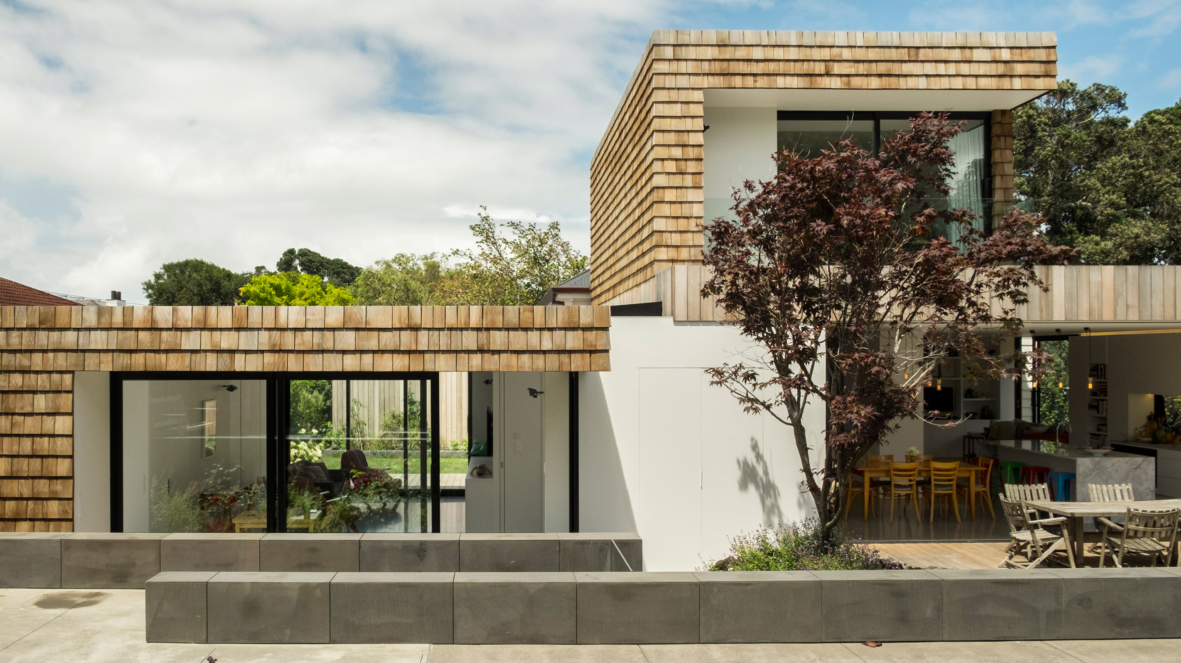 Gardens and terraces slot around timber extensions to Auckland house-0