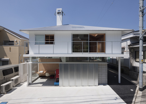House in Kawanishi by Tato Architects with hipped roof and stilts-4