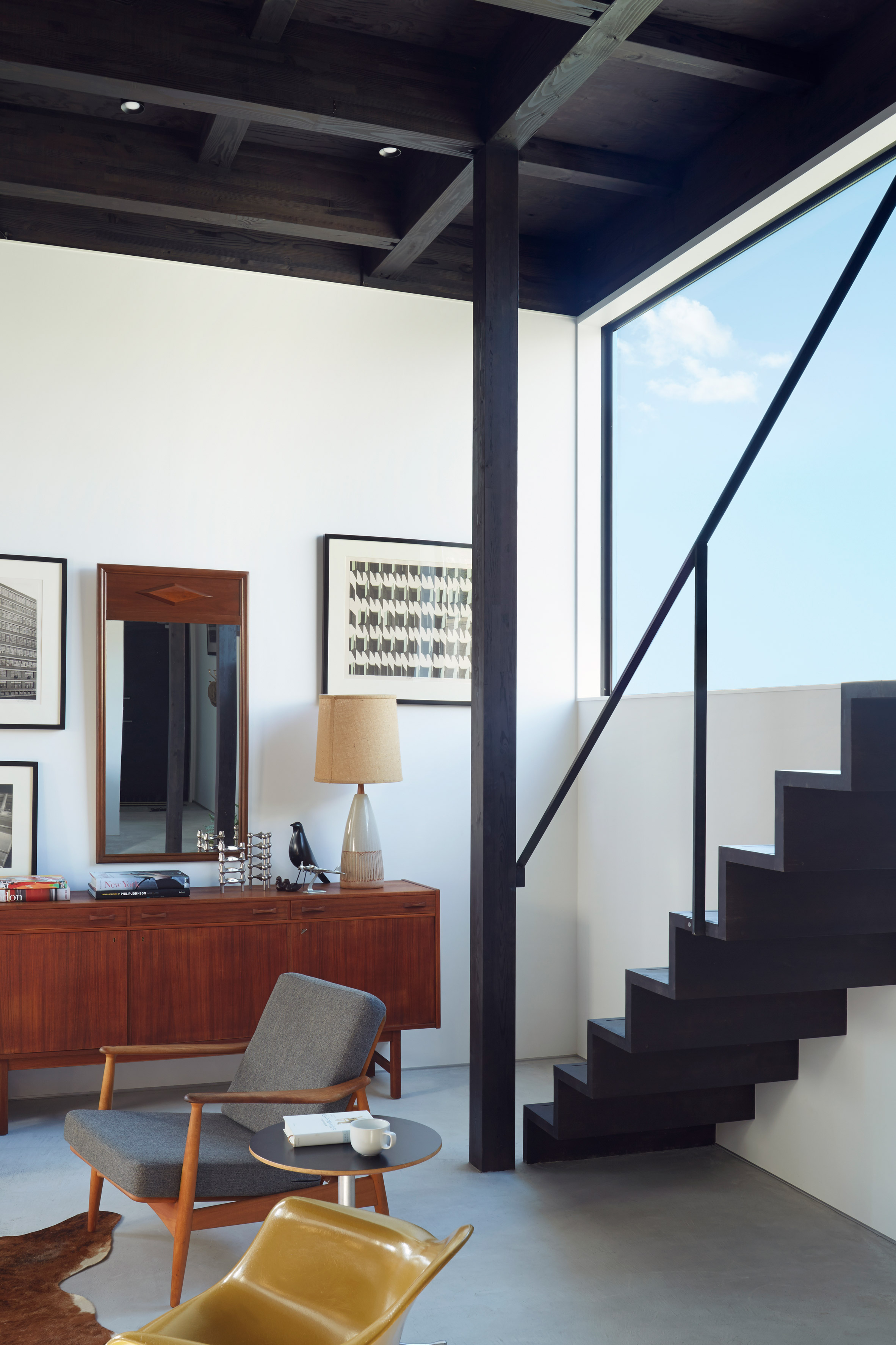 Black corrugated metal encases loft-inspired interiors of Japanese house by TakaTina-12