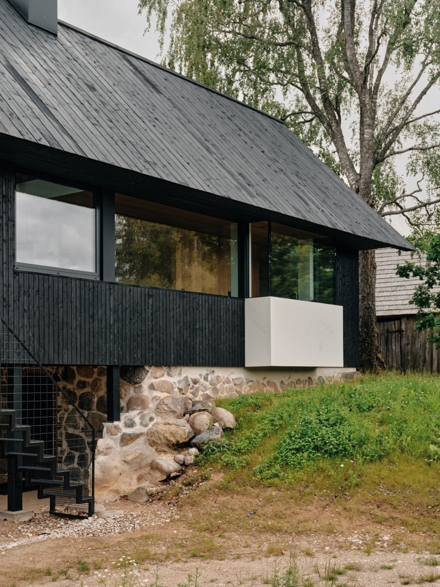 Stone cellar in Estonian forest forms base for wooden Põro House-13