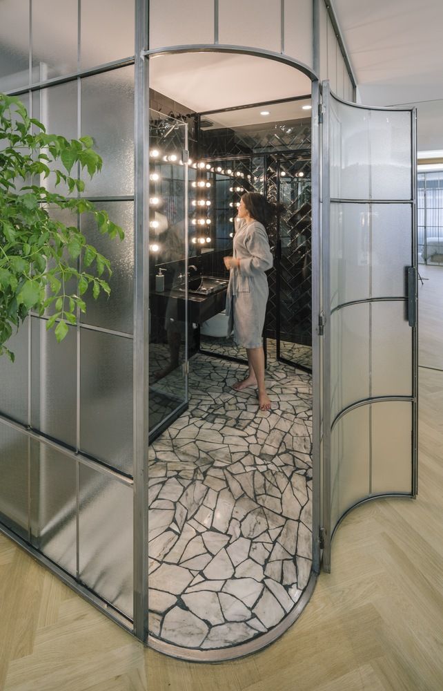 Glass Walls and Lots of Curves Distinguish Luxury Madrid Apartment Renovation-8