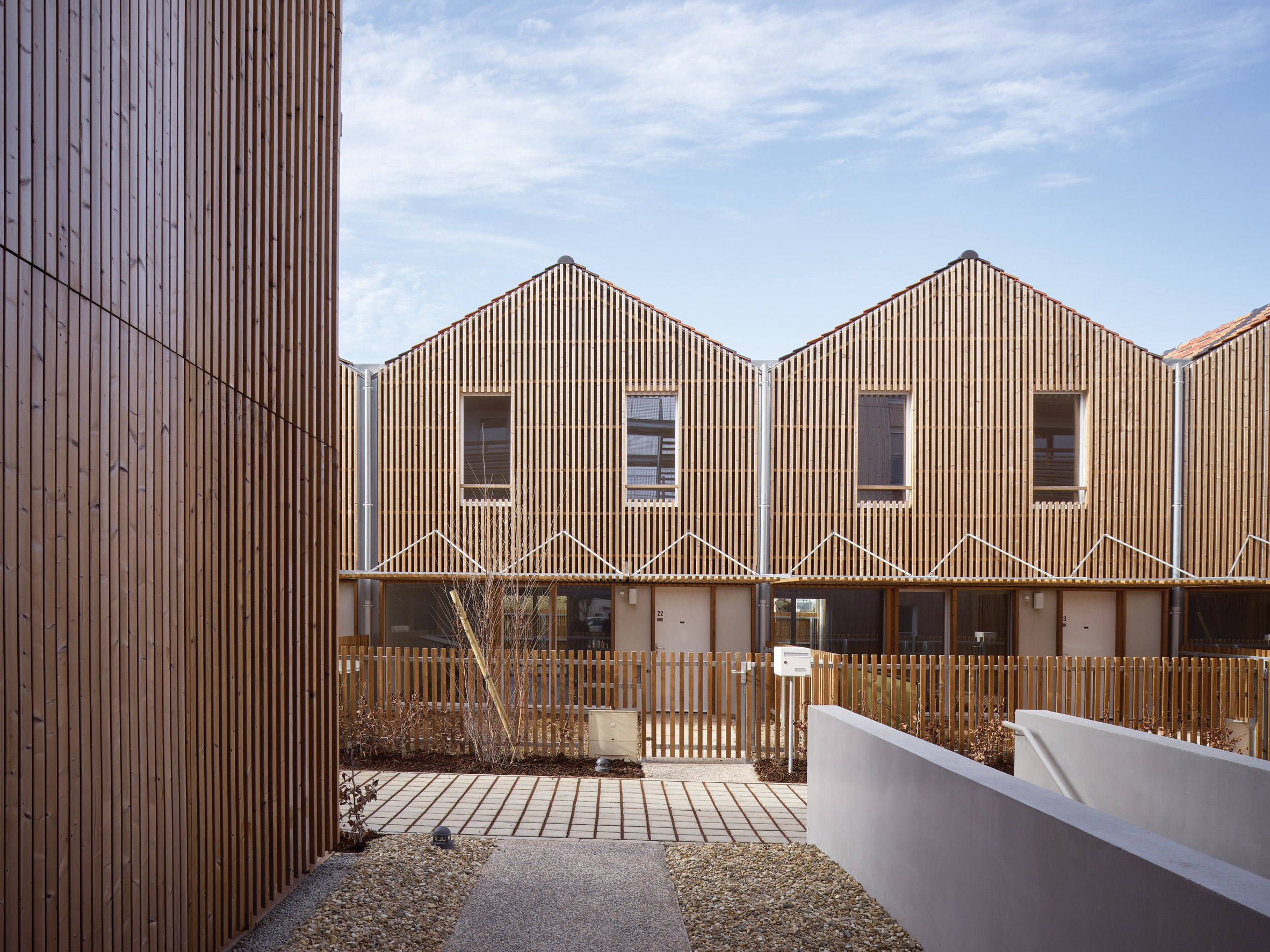 Odile Guzy Architectes covers social housing with vertical wooden slats-5