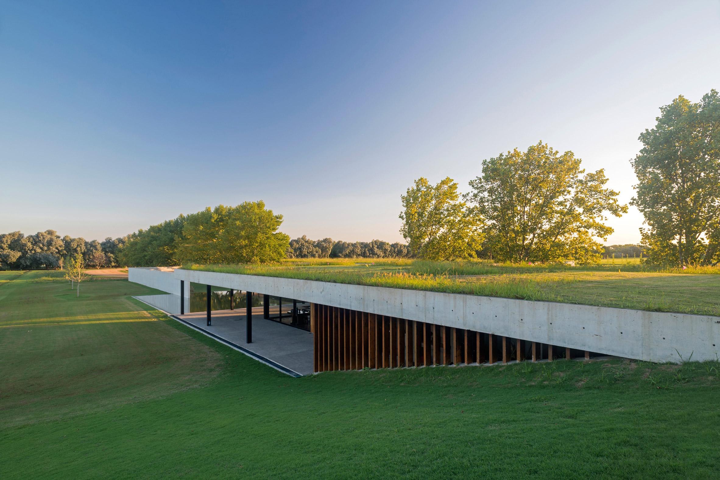 Polo stables features grassy roof for horses to graze and spectators to sit-11