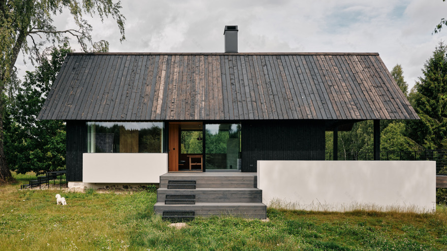 Stone cellar in Estonian forest forms base for wooden Põro House-0