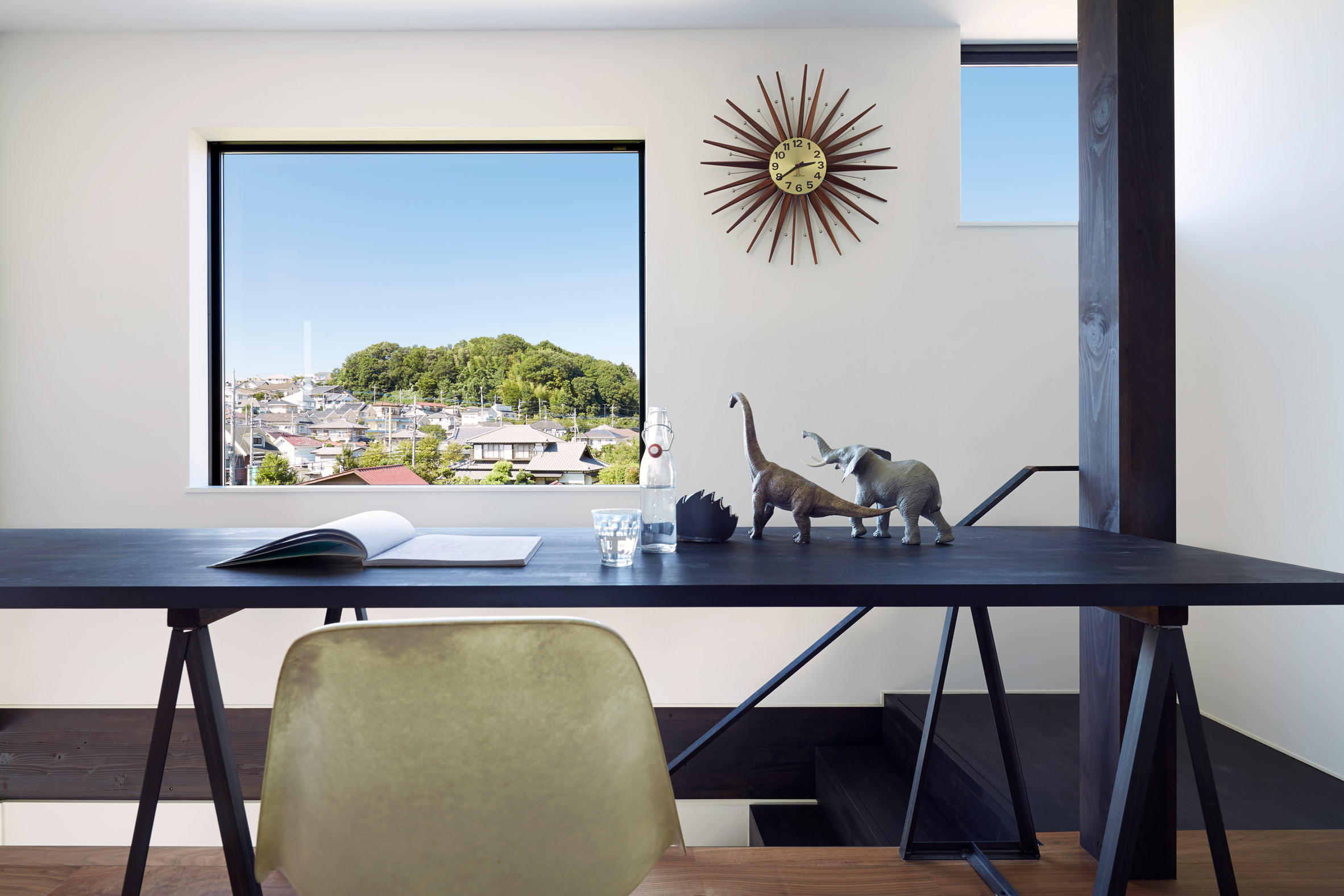 Black corrugated metal encases loft-inspired interiors of Japanese house by TakaTina-20