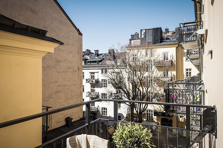 温馨暖色调的斯堪的纳维亚公寓设计-17