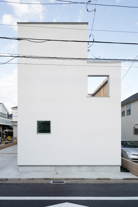 House K by Yuji Kimura Design conceals terraces behind a tall wall-8