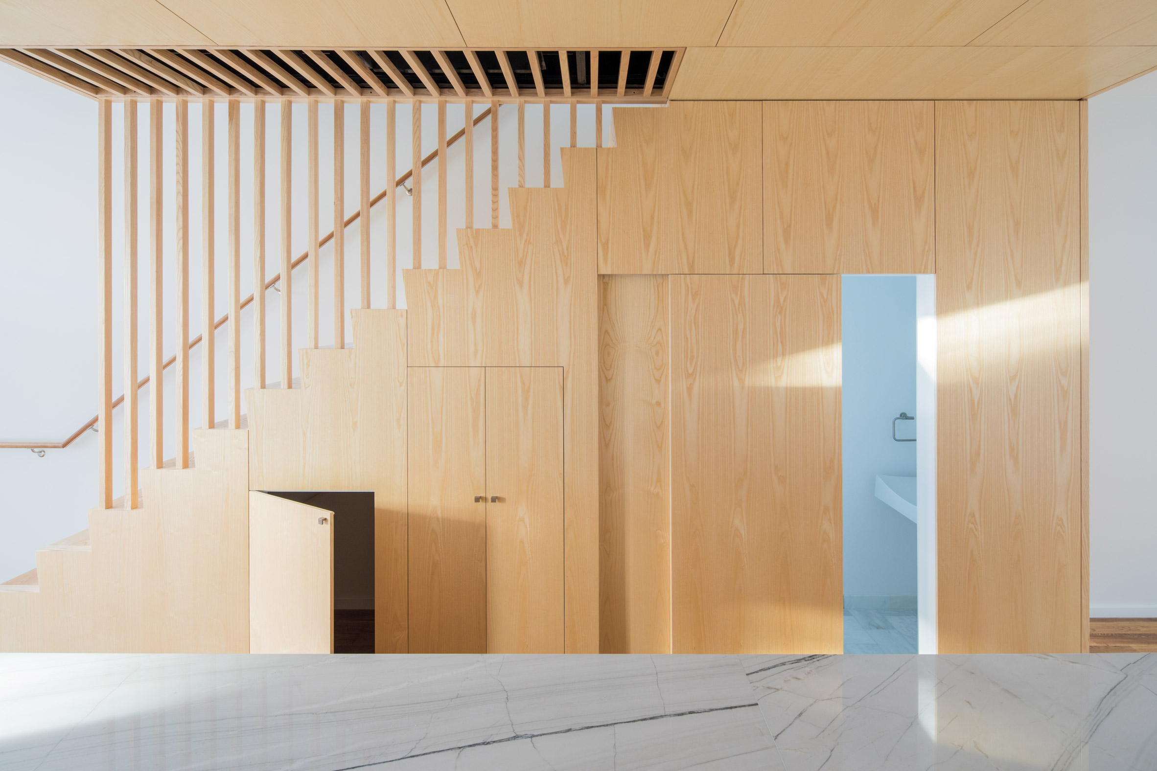 Jeff Jordan pairs white marble and pale pine in Jersey City house renovation-10