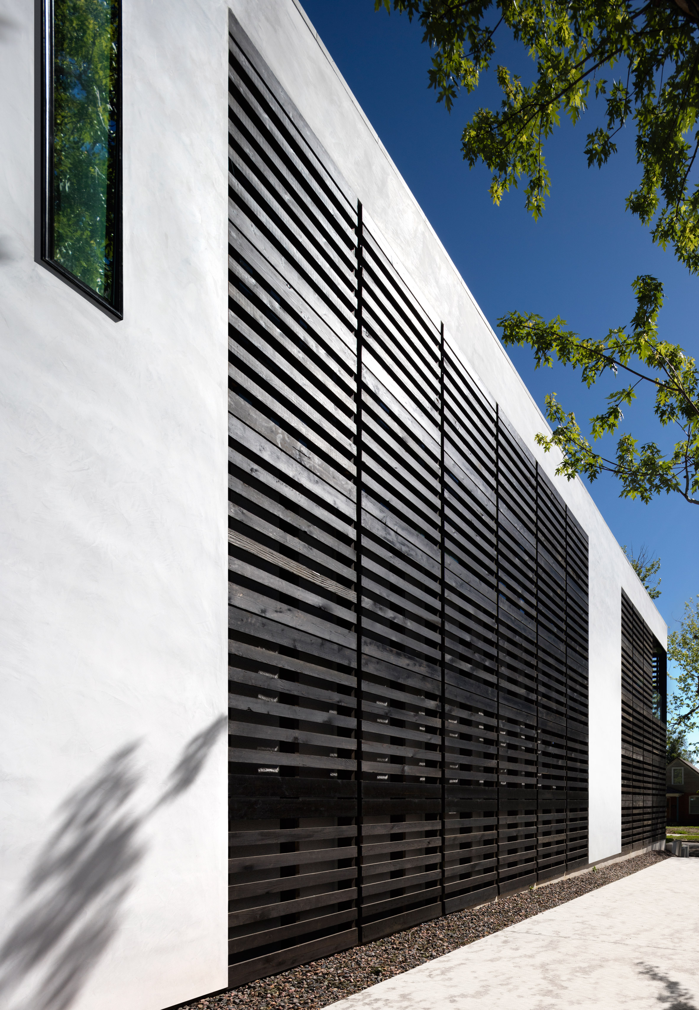 Meridian 105's Denver house features screens and shutters made of black wooden pallets-5