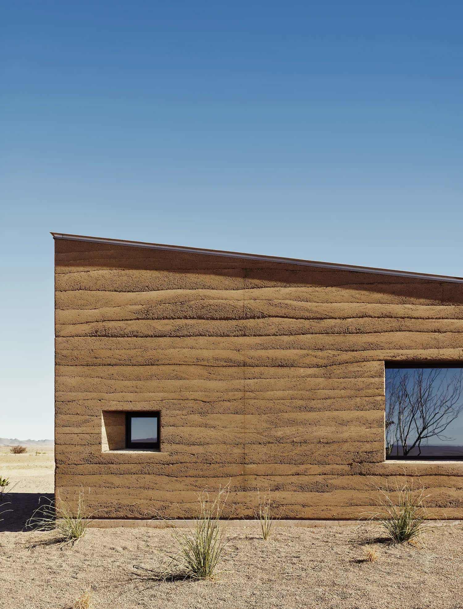 See this remarkable rammed earth house nestled on a Texas ranch-6