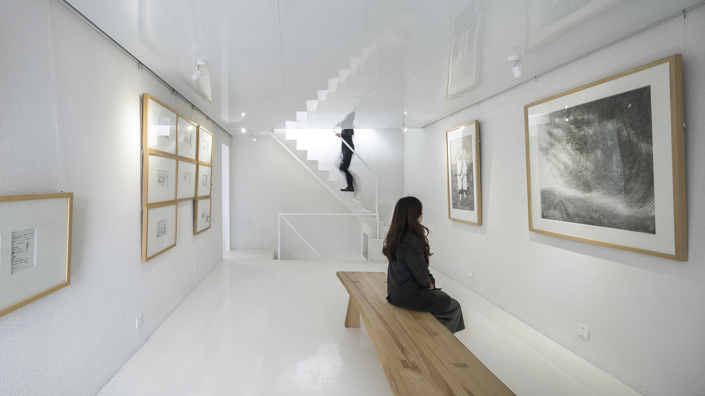 Latticed framework incorporates seating around the edges of Shenzhen hotel and cultural centre-14