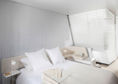 Okko hotel interior by Patrick Norguet with en suites behind louvred walls-10