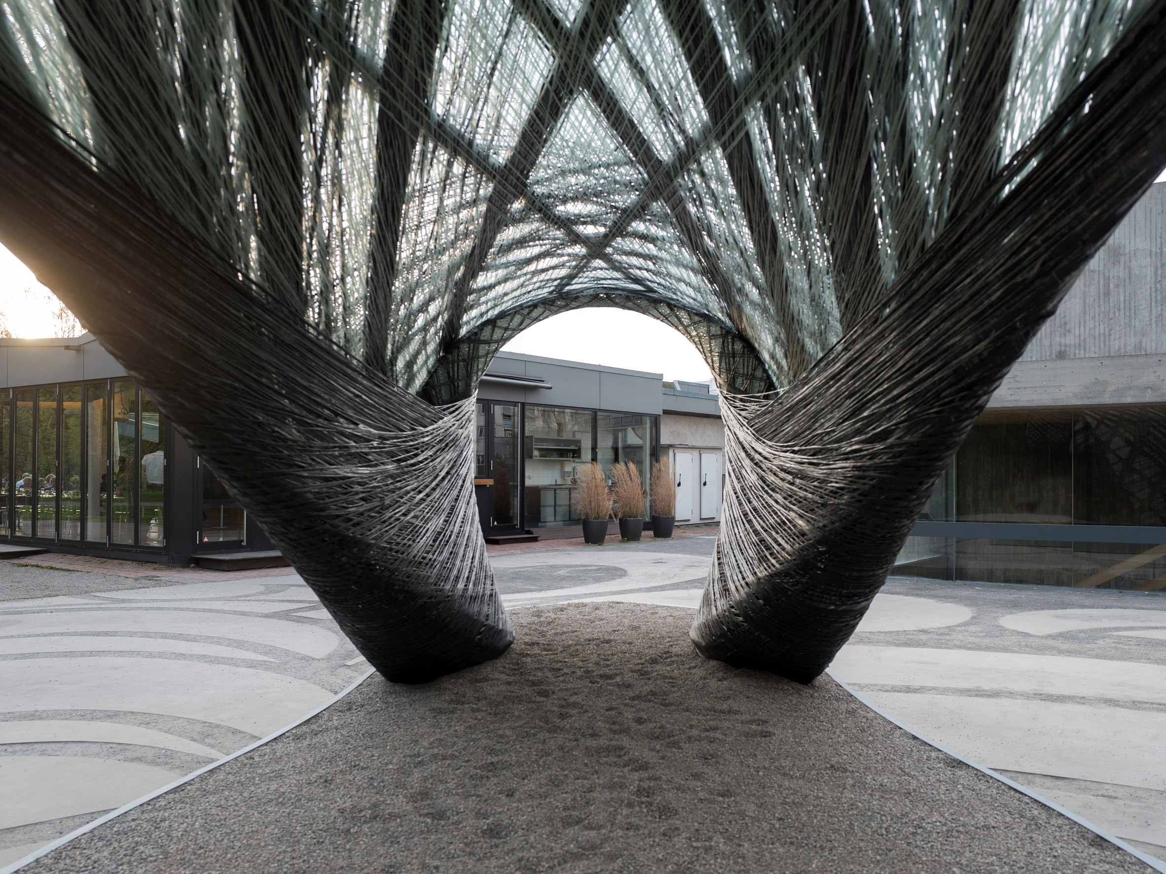 Drones and robots weave carbon-fibre pavilion based on moth webs-18