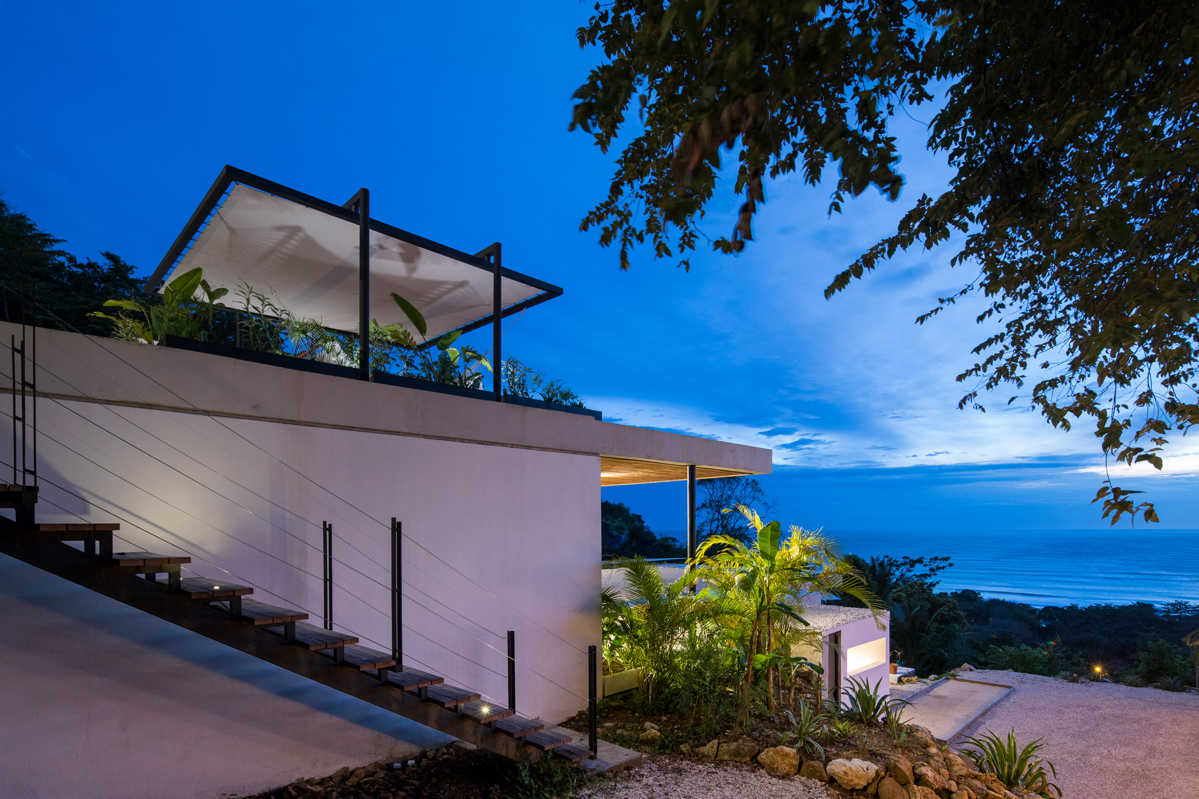 Staggered pavilions form holiday resort on lush hill in Costa Rican surf town-25