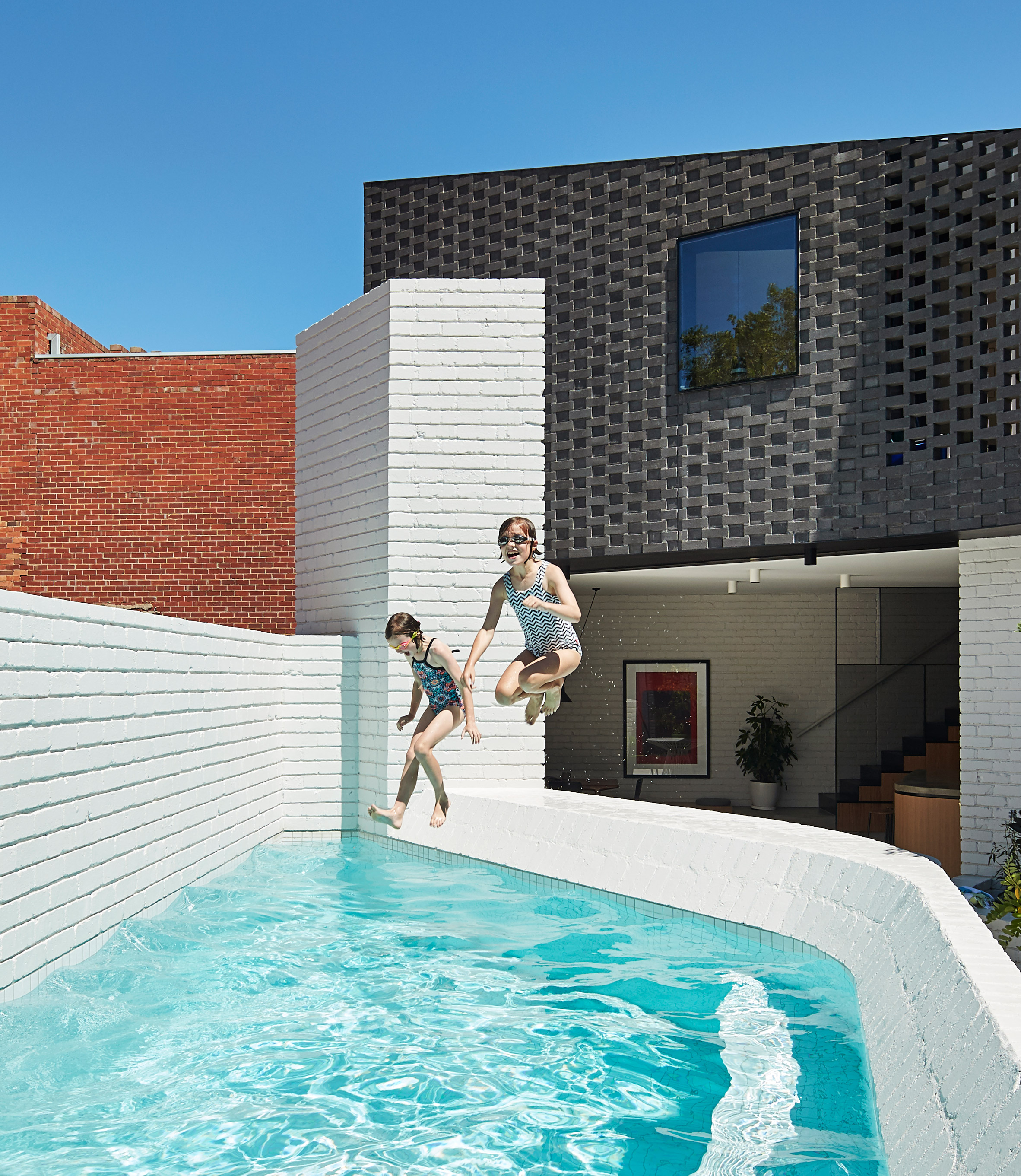 Perimeter House encloses private courtyard and swimming pool in Melbourne-15