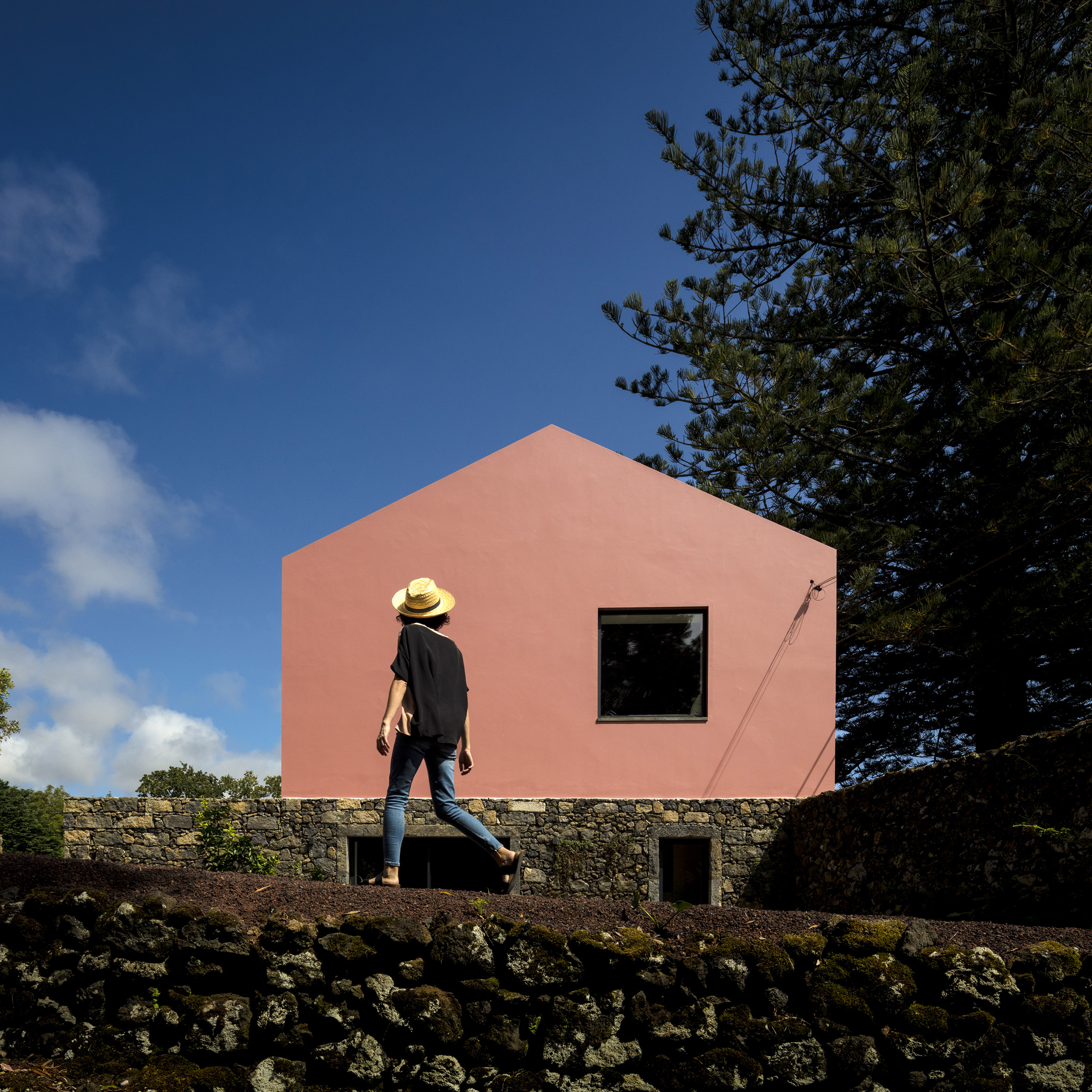 Mezzo Atelier transforms century-old barn into bright pink guesthouses-4
