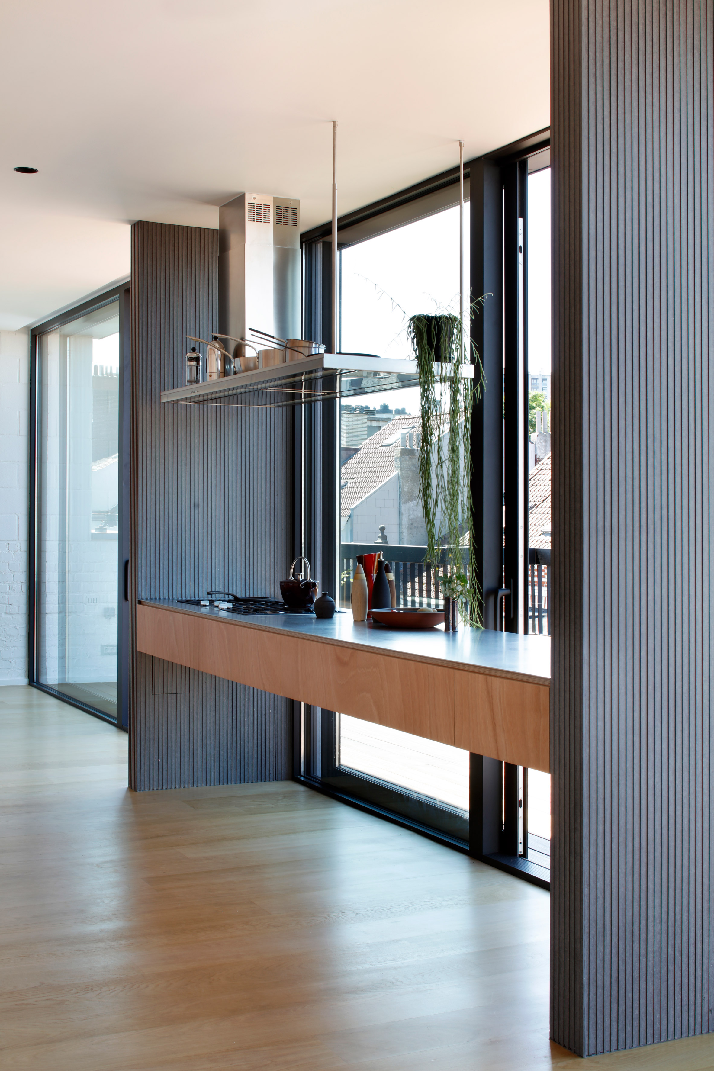 Alvar Aalto inspired the orange fireplace in this Brussels roof extension-19